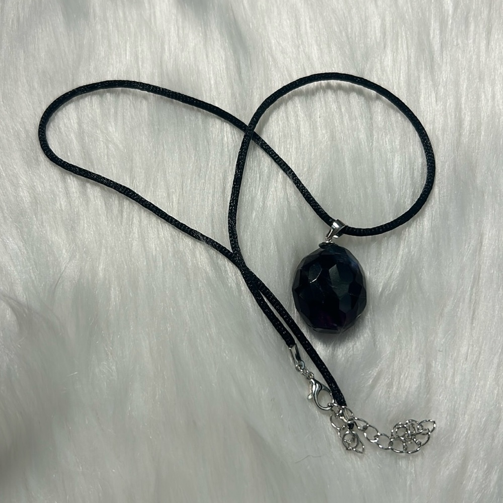 Rainbow fluorite pendant with rope necklace.